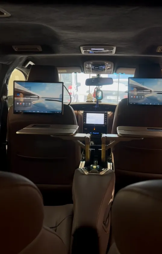 Captain recliners with tables and rear screens